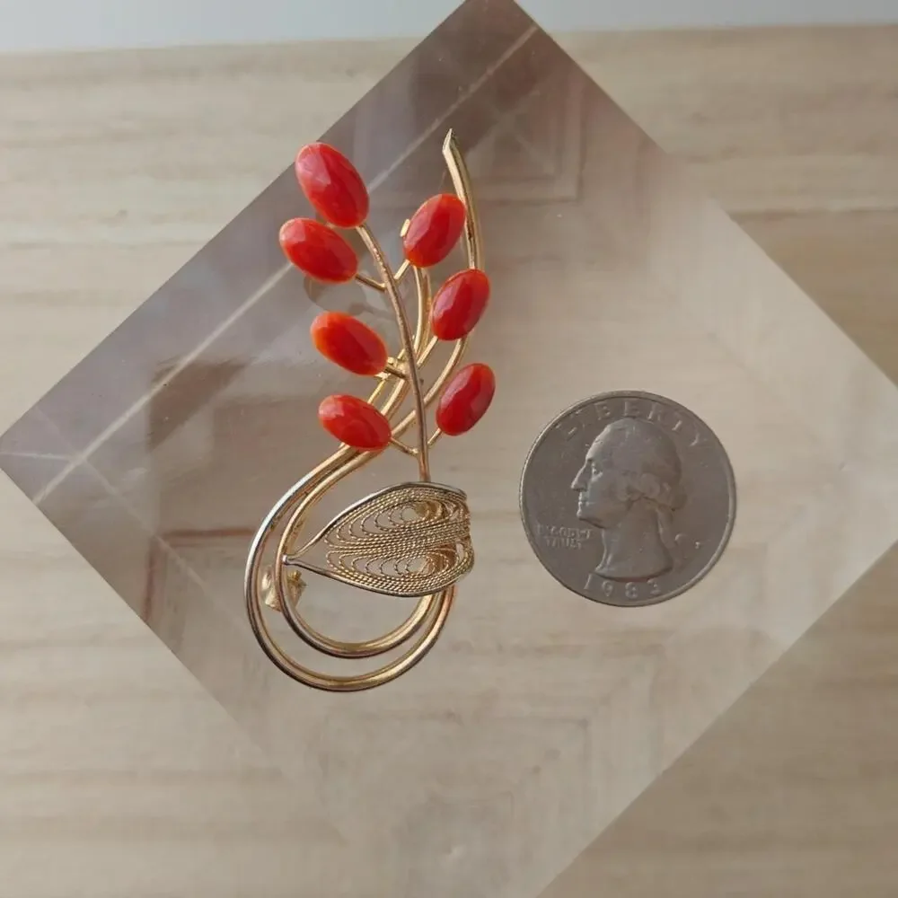 Vintage dark coral and gold tone floral spiral brooch